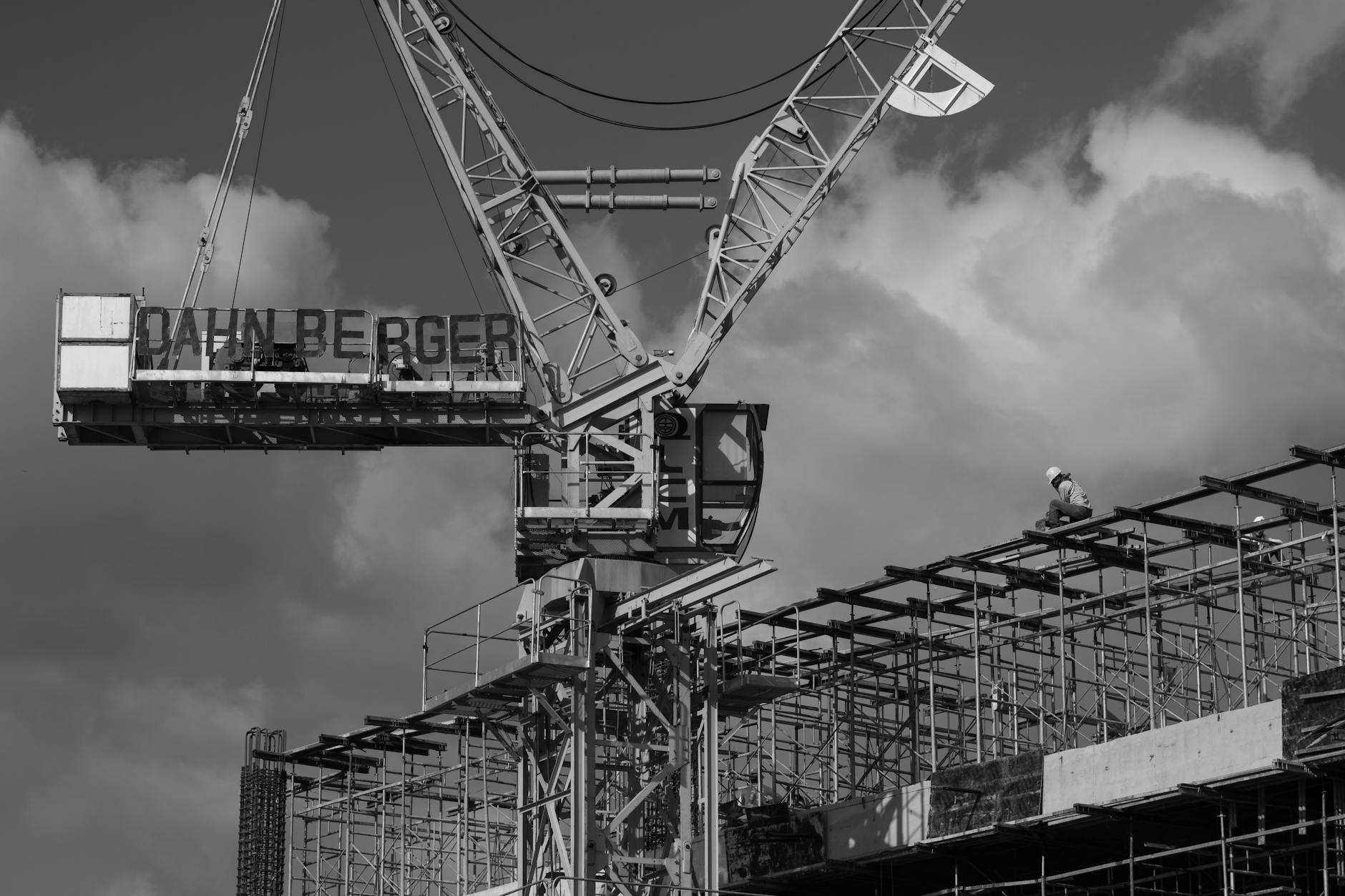 grayscale photo of metal crane